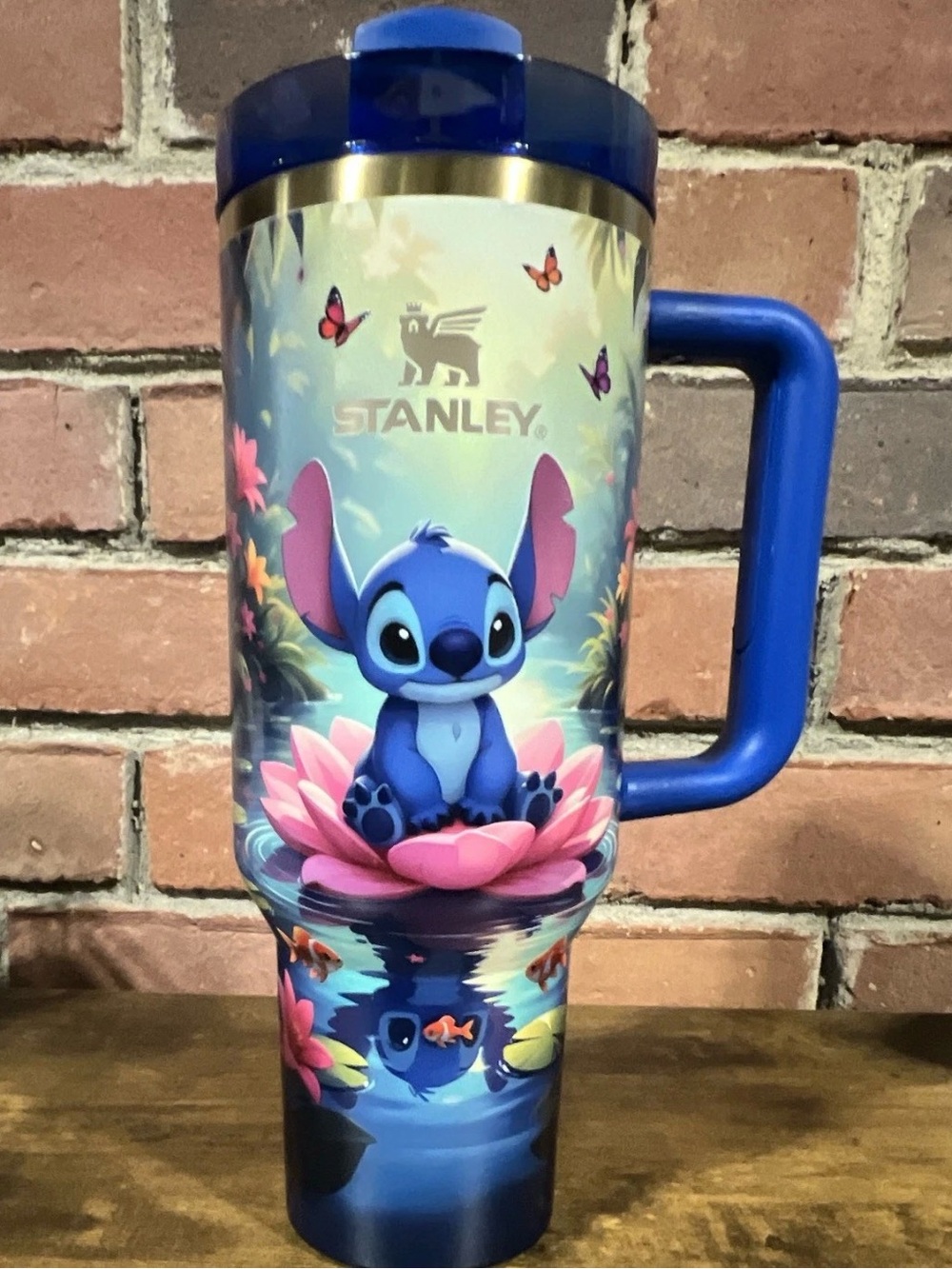 & Other Stories Blue Kids Travel Mug with Pink Floral Stitch Design